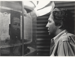 Robert Rauschenberg standing in front of the Dead Sea Scrolls in the Shrine of the Book at the Israel Museum, Jerusalem, 1974. Photo: Nir Bareket; © Nir Bareket (www.nirbareket.com)