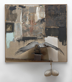 Collage with gray tones painted on canvas and a taxidermy eagle mounted on a platform protruding from the bottom center of the canvas