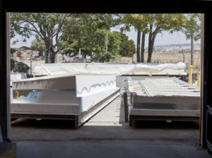 Concrete blocks viewed through a doorway with trees in the background