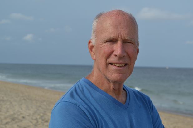 Philip Yenawine standing on the beach.