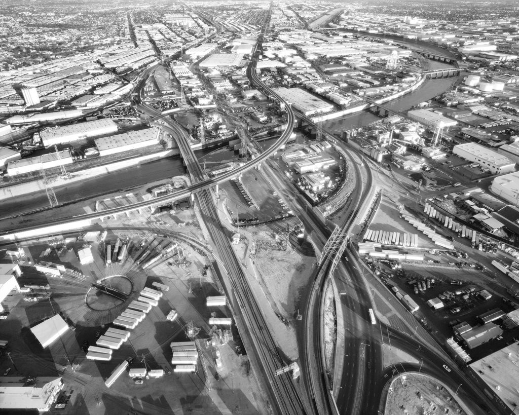 Artwork image, Michael Light's L.A. River and Washington Boulevard Looking East, Santa Fe Railroad Shops at Left