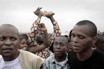 Tillim, photo of four men and one woman in crowd 