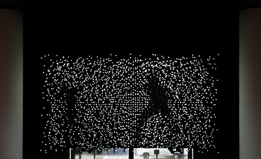 Jim Campbell, installation view of white lights on dark background