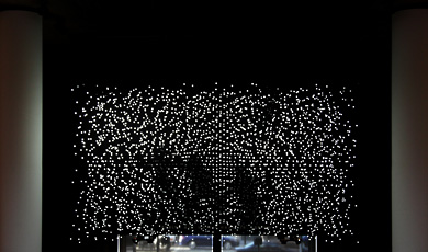 Jim Campbell, installation shot of white lights in dark room