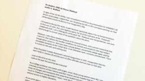 White paper with black text reading "On Student, 1968 by Wayne Thuebaud"
