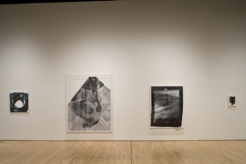 A room with several works by Paul Sietsema