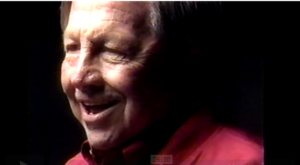 Color film still of the artist Robert Rauschenberg